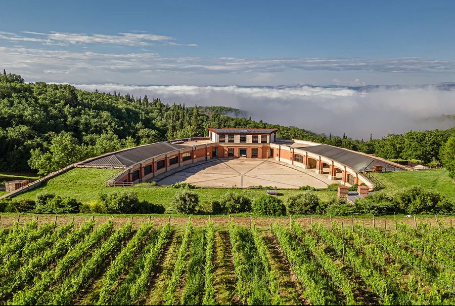 Wine estate amid Chianti vineyards at dawn